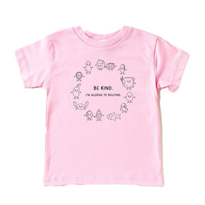 Anti-bullying light pink t-shirt with black graphic showing the top 8 allergens with the phrase "Be kind. I'm allergic to bullying".
